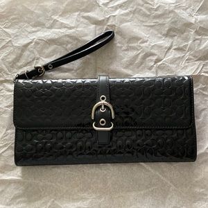 Coach logo embossed patent leather clutch bag